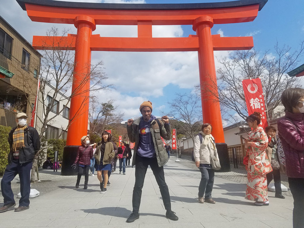 KCP student in front of the torii at the Fushimi Inari entrance